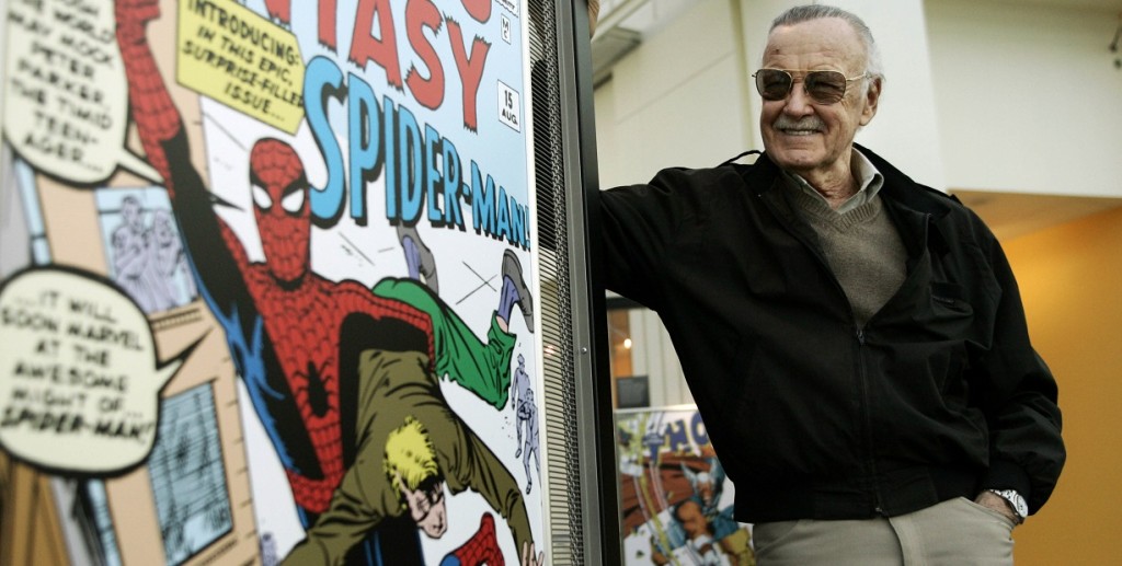 FILE - In this March 21, 2006 file photo, comic book creator Stan Lee stands beside some of his drawings in the Marvel Super Heroes Science Exhibition at the California Science Center in Los Angeles. The Walt Disney Co. on Monday, Aug. 31, 2009 said it is buying Marvel Entertainment Inc. for $4 billion in cash and stock, bringing such characters as Iron Man and Spider-Man into the family of Mickey Mouse and WALL-E. (AP Photo/Damian Dovarganes, file)